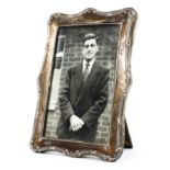 A sterling silver desk top photo frame. 16cm x 11cm.