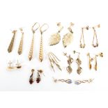 A collection of 9ct gold and unmarked yellow metal stud and drop earrings.