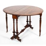 A Victorian walnut circular folding gateleg table, late 19th century,