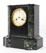 A late 19th century French marble and slate striking clock, with white dial and Roman numerals,