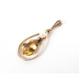 A yellow metal pendant set with citrine quartz and pearl. Hallmarked 9ct gold, Birmingham.