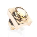A 9ct gold panel ring set with an oval faceted citrine quartz