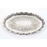 A Victorian silver plated oval footed tray, engraved with shaped oval cartouches,