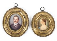 Two Victorian portrait miniatures of a lady and gentleman, each bust-length, probably on ivory,