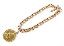 A yellow metal curb link bracelet.