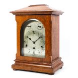 A three-train German strike/silent,oak bracket mantel clock, early 20th century,