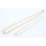 Two early 20th century ivory necklaces of graduated beads,