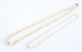 Two early 20th century ivory necklaces of graduated beads,