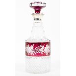A moulded glass silver collared decanter with etched cranberry glass detail.