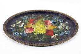 A painted oval tin tray, 20th century, painted with a bouquet of fruit and flowers on a blue ground,