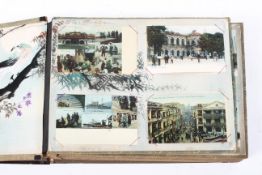 An Asian lacquered Shibayama-style postcard album mounted with assorted postcards of Hong Kong,