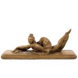 n Art Deco style plaster model of a reclining ballerina with etched signature to plinth.