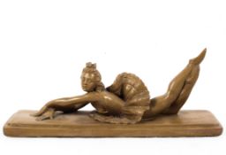 n Art Deco style plaster model of a reclining ballerina with etched signature to plinth.