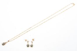 A 9ct gold sapphire and diamond set pendant on 9ct fancy link necklace with matching earrings. 4.1g.