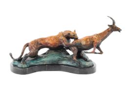 A patinated bronze group of cheetah hunting an antelope, 20th century,