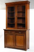 A early 20th century two part glazed bookcase. Two glazed doors over two cupboard doors.