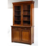 A early 20th century two part glazed bookcase. Two glazed doors over two cupboard doors.