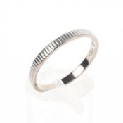 An 18ct white gold 2.3mm ridge design wedding band. Hallmarked 18ct gold, London.