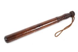 A turned wood military truncheon, early 20th century,