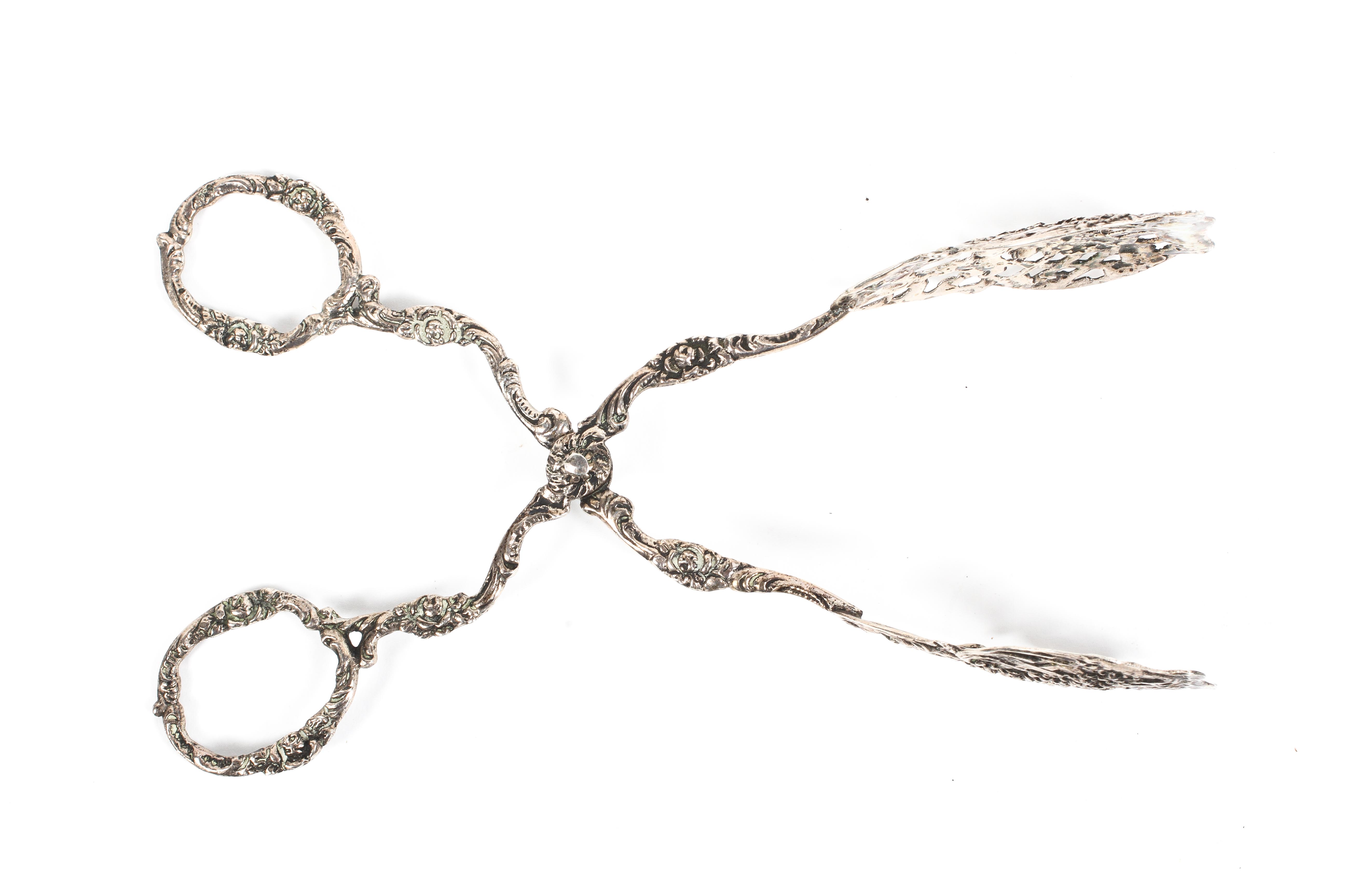 A pair of profusely decorated Swedish white metal tongs 63 g