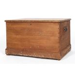 A pine blanket box with hinged cover, internal candle box and handles,