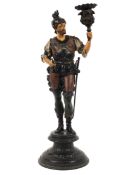 A 19th century spelter figural candlestick, cast as a standing soldier holding a foliate nozzle,