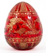 A Faberge (St Petersburg) cut glass gilt ruby egg, 20th century, blue label to underside,