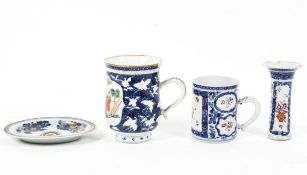 Two Chinese Export mugs and an oval stand,