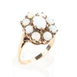A 9ct gold opal cluster ring, London, 1982. Size L