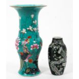 A Canton turquoise baluster beaker vase together with a Chinese black ground small oviform vase,