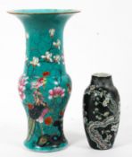 A Canton turquoise baluster beaker vase together with a Chinese black ground small oviform vase,