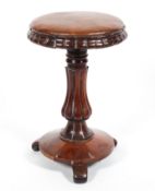 A 19th century rosewood adjustable piano stool, on baluster gadrooned stem, on scroll feet,