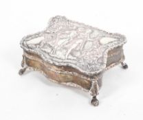 A small sterling silver jewellery casket on four ball and claw feet with velvet lined interior, 7.