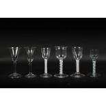 A collection of six English drinking glasses, circa 1770, including four opaque twist wine glasses,