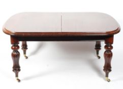 A Victorian mahogany extending dining table,