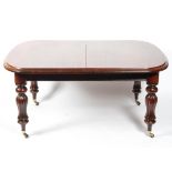 A Victorian mahogany extending dining table,