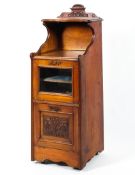 A Victorian walnut music cabinet, circa 1900, with galleried shelf,