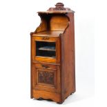 A Victorian walnut music cabinet, circa 1900, with galleried shelf,