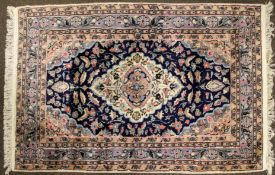 A Tabriz style rug with five borders and central medallion, 180cm x 122cm.