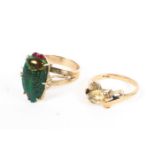 Two 9ct gold rings, an enamelled scarab beetle together with a single stone citrine quartz ring,
