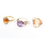 A collection of three rings - A 9ct cameo ring; An 18ct agate ring;