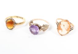 A collection of three rings - A 9ct cameo ring; An 18ct agate ring;