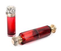 A double ended cranberry glass scent bottle and a silver mounted example