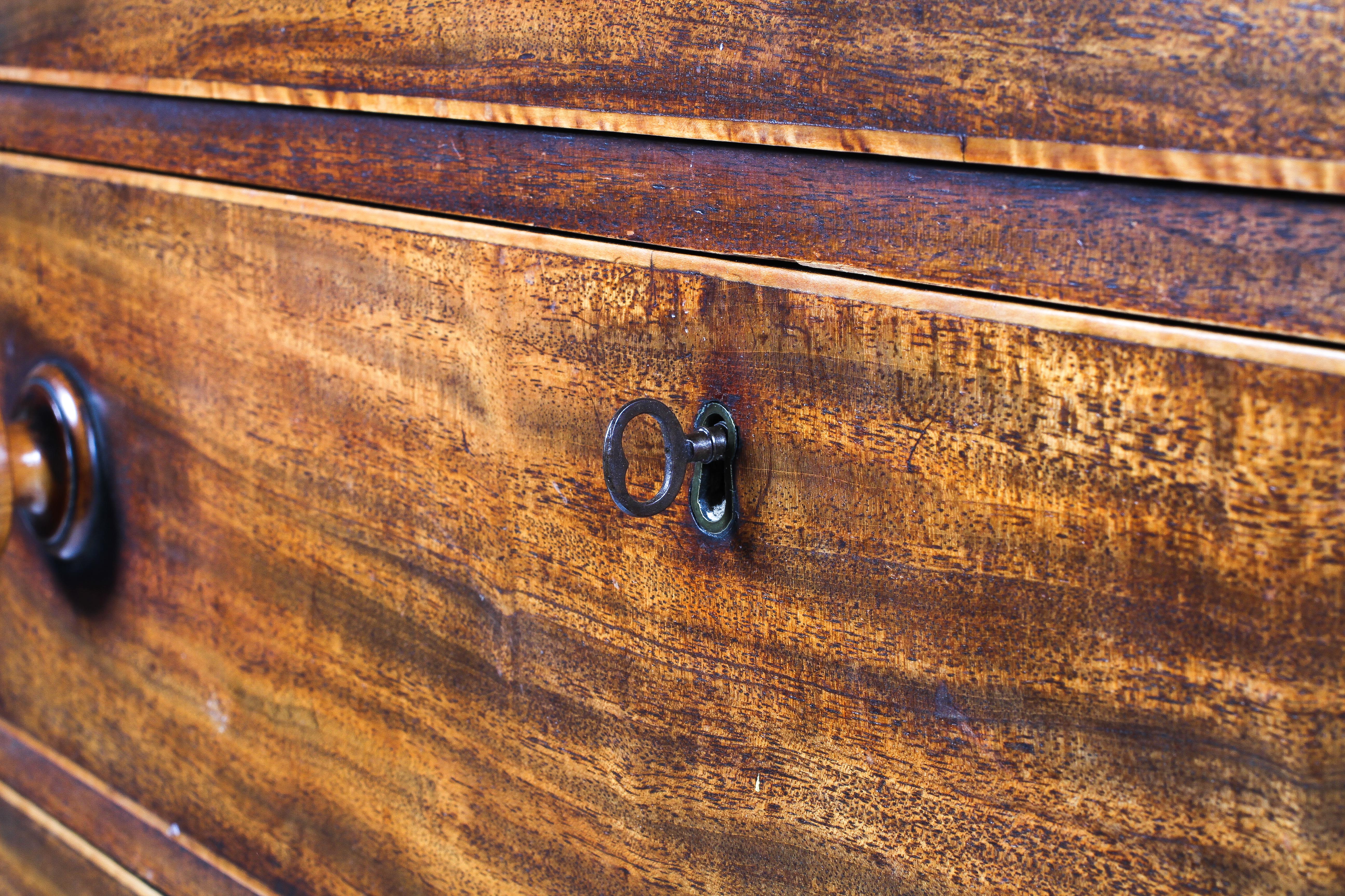 A 19th century mahogany chest of drawers, inlaid with stringing, with four graduated long drawers, - Image 3 of 3