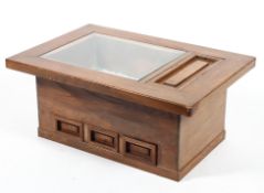 A Japanese Hibachi, with part glazed top and lidded compartment, above three short drawers,