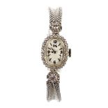 A vintage ladies 14ct white gold and diamond wristwatch,
