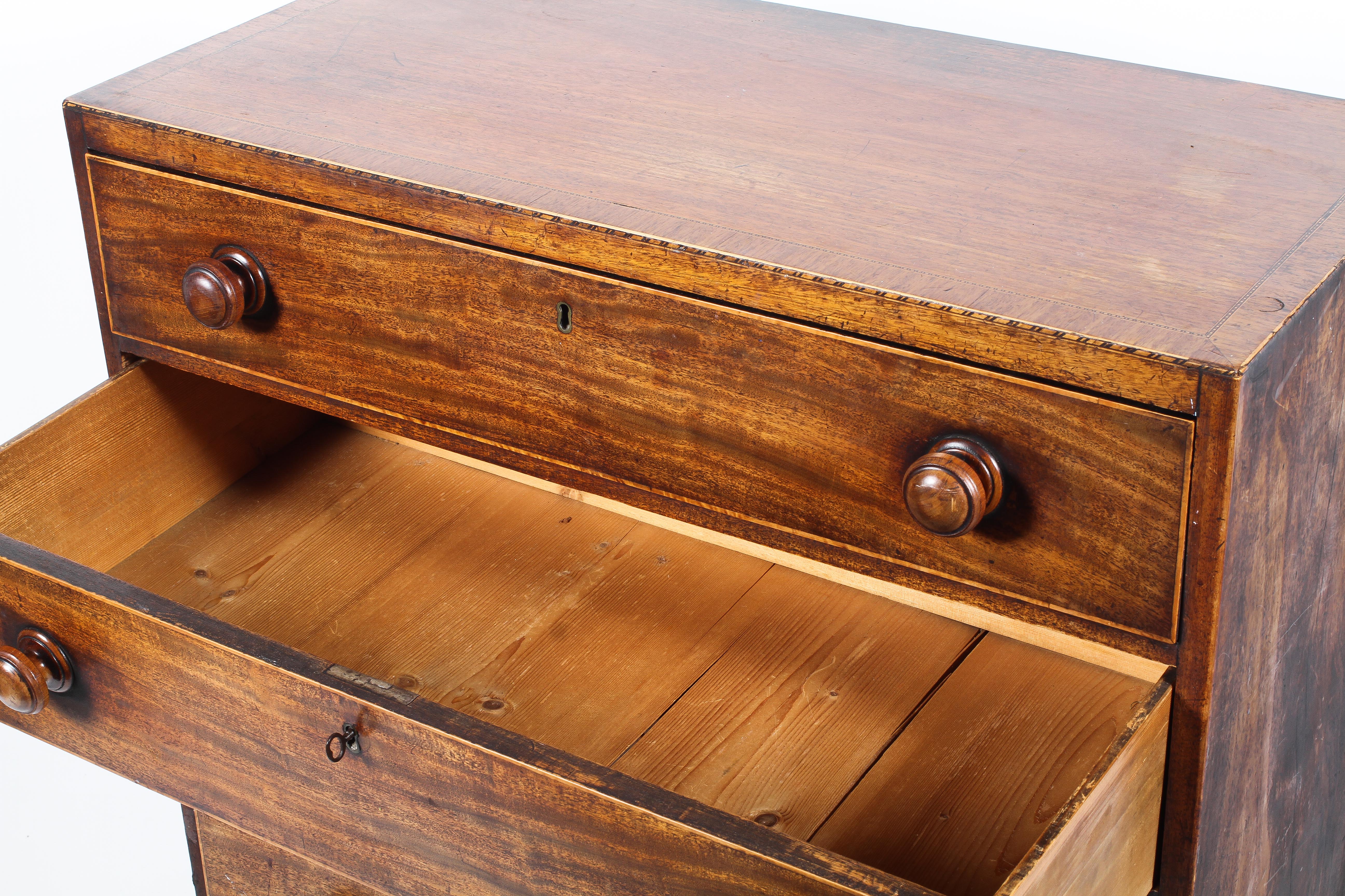 A 19th century mahogany chest of drawers, inlaid with stringing, with four graduated long drawers, - Image 2 of 3