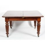 A William IV mahogany extending dining table, with two additional leaves,