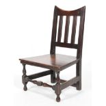 A Victorian oak child's chair, with curved top rail, pierced back and plain seat,