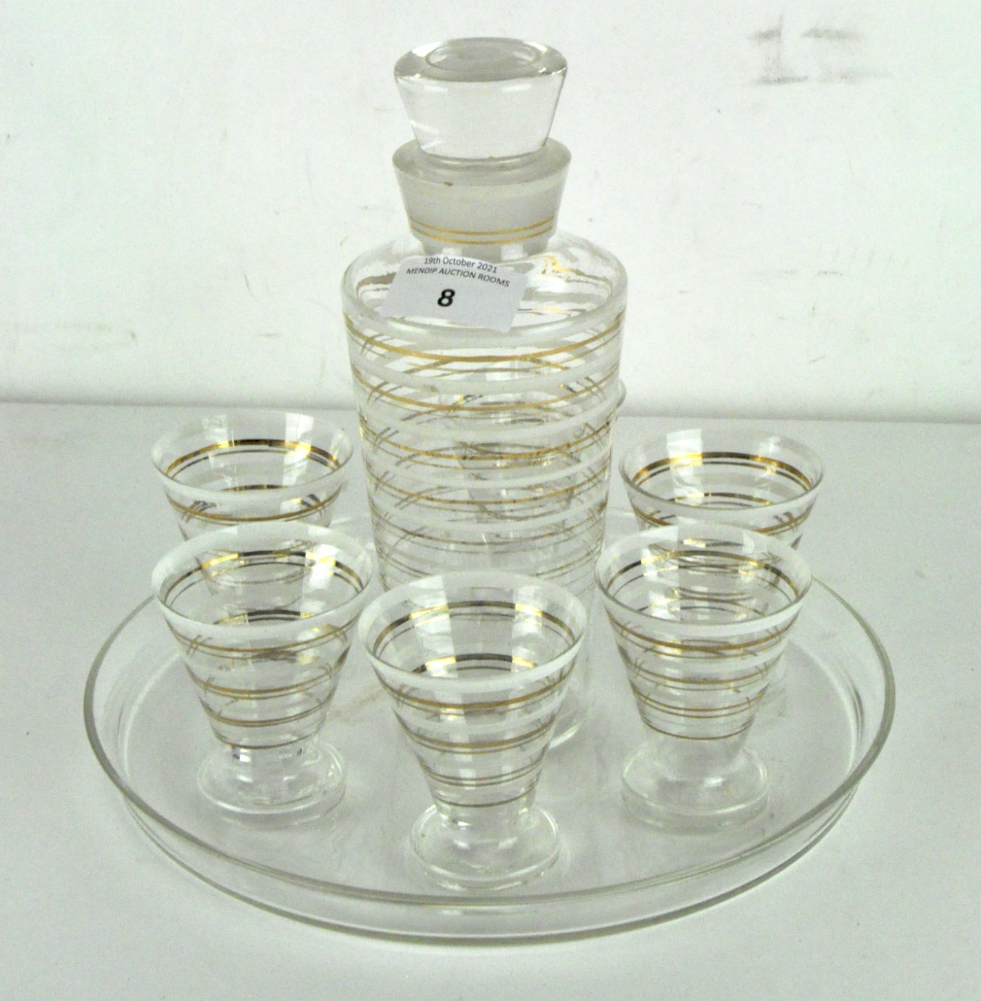 An Art Deco glass cocktail serving set with six matching glasses and tray,